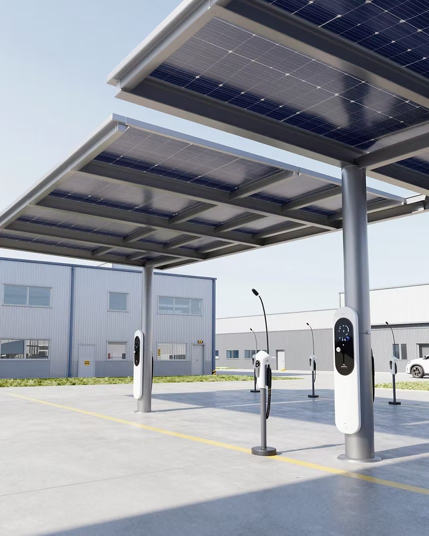 Commercial EV charge points beneath a steel solar canopy at a business park